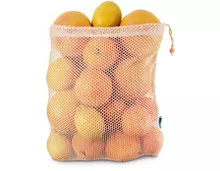 Multibag oder Tragtasche füllen mit diversen Zitrusfrüchten